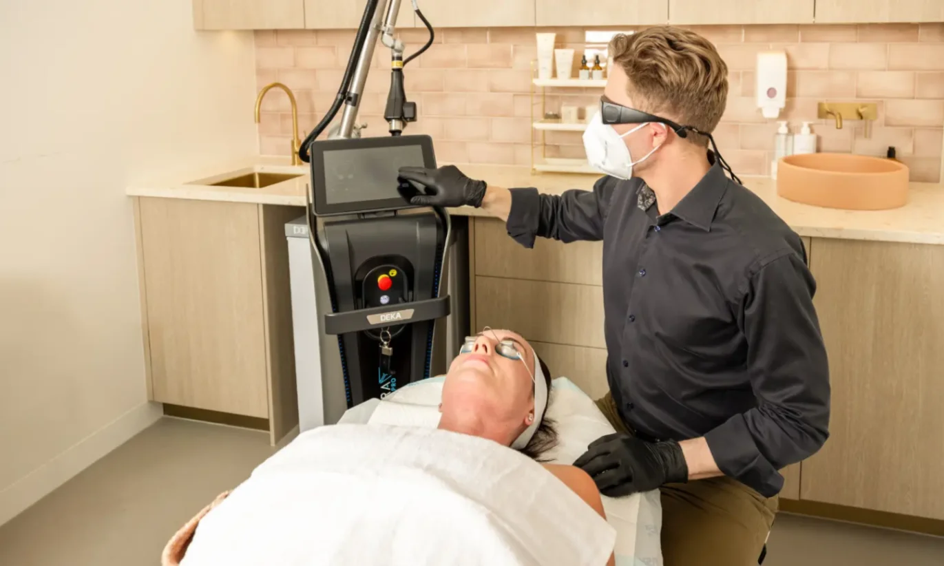 Clinician using a laser device for Fraxel vs CO2 education